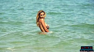 Stunning Ukrainian centerfold Cara Mell's solo beach stripping performance