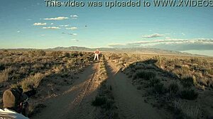 Big girl in cowgirl position on the outskirts of the city at sunset