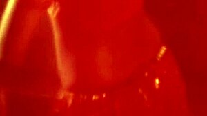 A sexy brunette dancer performs erotic moves while she is alone on the screen