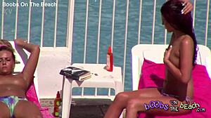 Topless Beauty Oiled Up with Pierced Nipples and Tattoos on Holiday.