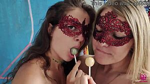 Two girls who like sucking on lollipops also like to perform oral sex on a man