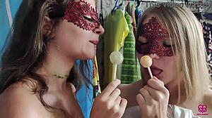Two girls who like sucking on lollipops also like to perform oral sex on a man