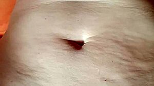Close up of a shaved pussy during a solo pleasure scene
