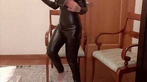 Black catsuit clad dancer performs provocative belly dance for financial gain